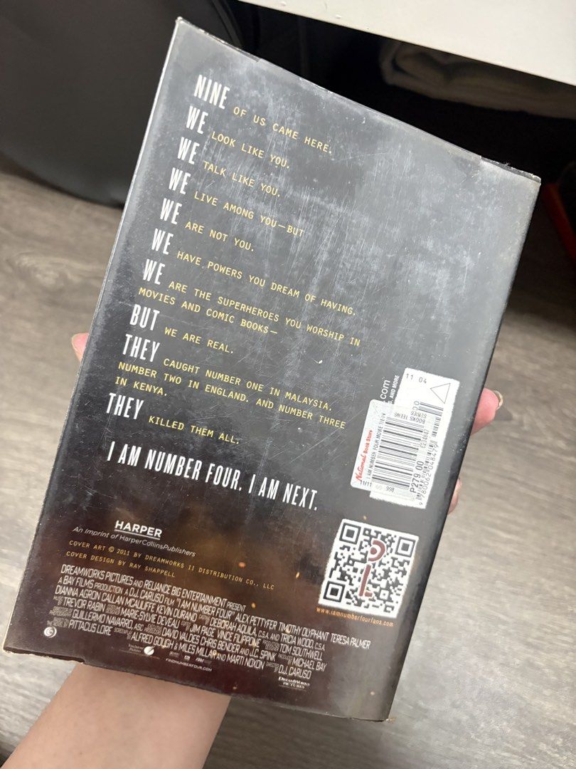 I Am Number Four by Pittacus Lore paperback (Category: Storybooks) located in Imus. Submitted by _monicakes (Listing ID 1467099415, Image 3). Description: - Title: I Am Number Four by Pittacus Lore - Edition: Movie tie-in with Alex Pettyfer poster cover - Publisher: Harper - Condition: Pages are yellowed from age, with cover edge wear and spine creasing - Genre: Young Adult / Sci-Fi.