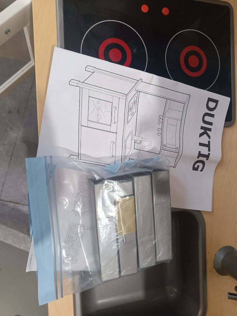 IKEA DUKTIG Play Kitchen Toy (Category: Kids Toys) located in Manila. Submitted by mateochest99469 (Listing ID 1467055893, Image 3). Description: - Item: IKEA DUKTIG Play Kitchen - Features: Wooden frame, stove top, sink, microwave, and lower cabinets - Inclusions: Original instruction manual and a bag of metal utensils - Condition: Clean, well-maintained, and great for imaginative play - Meet-up or delivery options available upon request.