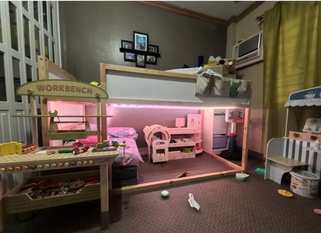 IKEA KURA Reversible Bed (Category: Bed Frames & Mattresses) located in Paranaque City. Submitted by emmafashionera (Listing ID 1467085947, Image 3). Description: - Item: IKEA KURA Reversible Bed - Color/Material: White and Pine, Solid Wood Frame - Size: 90x200 cm - Setup: Currently configured as a loft bed with a cozy play den underneath - Perks: Excellent space saver for kids' rooms, mattress NOT included! - Note: Buyer must handle the dismantl