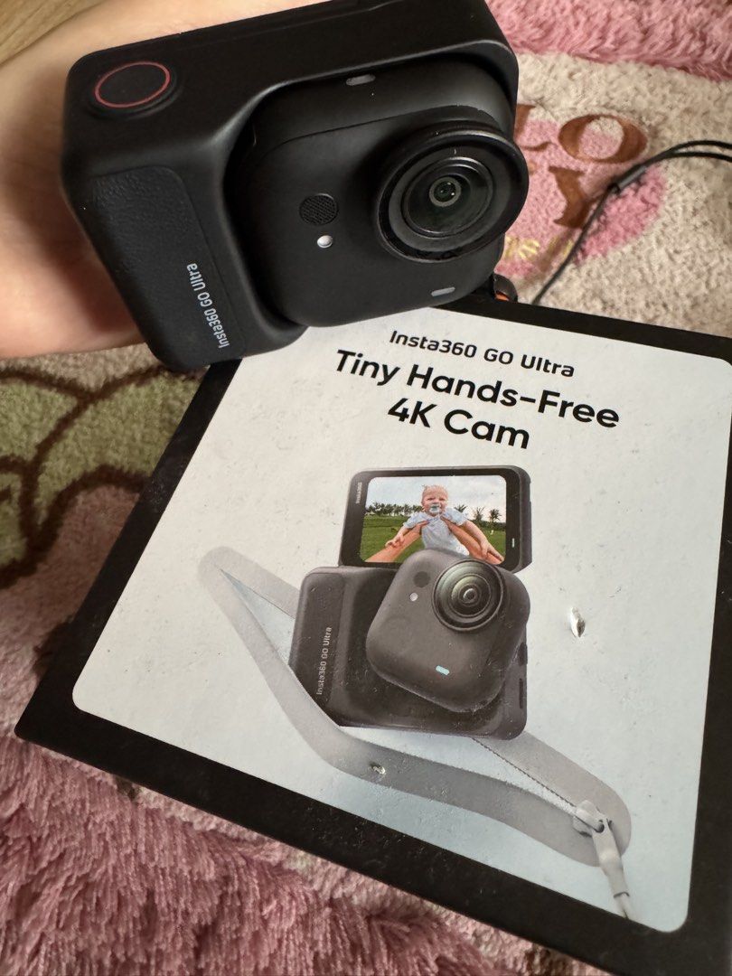 Insta360 GO Ultra Tiny Hands-Free 4K Cam (Category: Video Cameras) located in Caloocan City. Submitted by btstlannjie (Listing ID 1467164905, Image 2). Description: - Insta360 GO ultra-tiny 4K hands-free camera package - Includes camera unit, housing case, charging cable, neck lanyard, mini tripod handle, and multiple mounting accessories - Original box included - Clean, fully working shape - Perfect for action vlogs and travel recording - 5month