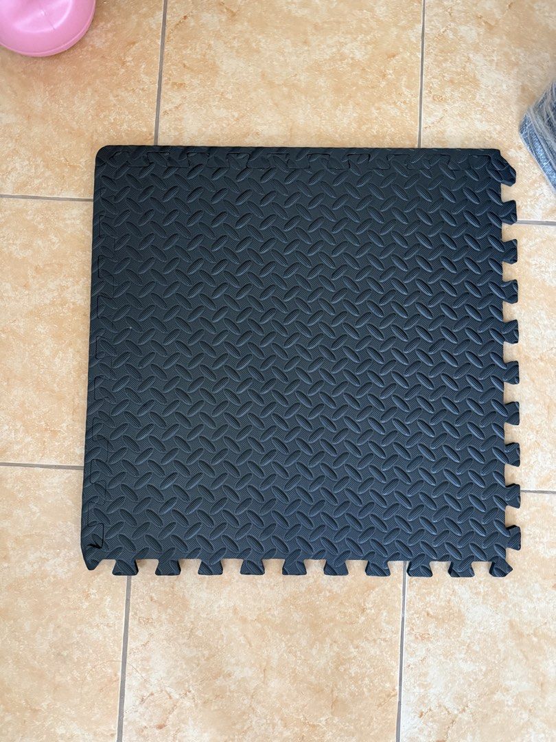 12 Pcs Set with IKEA bag - Interlocking Foam Exercise Gym Floor Mats (Category: Exercise Mats) located in Taguig. Submitted by secondlifeph (Listing ID 1466971682, Image 2). Description: - Color: Black - Versatile design: Textured surface on one side, smooth on the other - 60cm x 60cm each piece - Thick cushioning protects floors during heavy workouts and provides a safe surface for play areas - Interlocking tiles are easy to assemble and customi