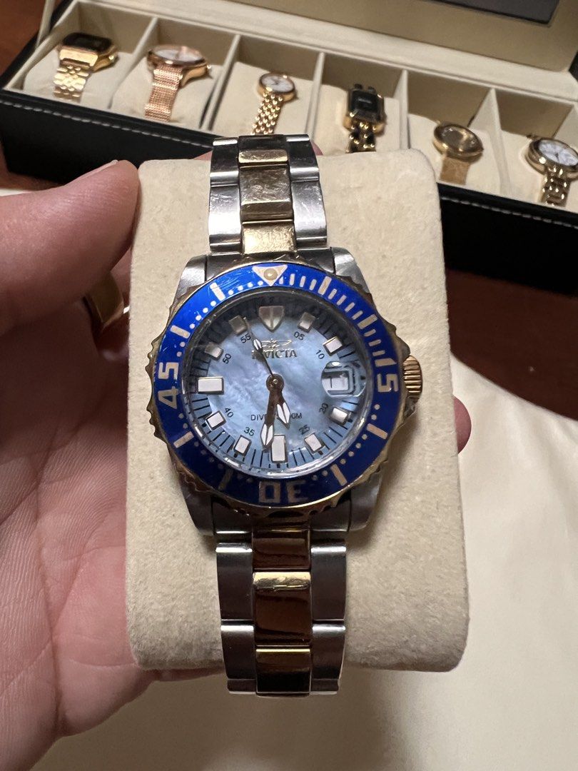 Invicta Pro Diver 2961 Two-Tone Blue Dial Watch (Category: Luxury Watches) located in Manila. Submitted by kai.168 (Listing ID 1467118540, Image 1). Description: - Brand: Invicta Pro Diver (Model 2961) - Design: Two-tone stainless steel and gold-tone bracelet - Dial: Striking blue mother-of-pearl with date window at 3 o'clock - Bezel: Rotating blue bezel with gold markers - Water Resistance: Up to 200 meters - Security: Screw-down crown and fold-