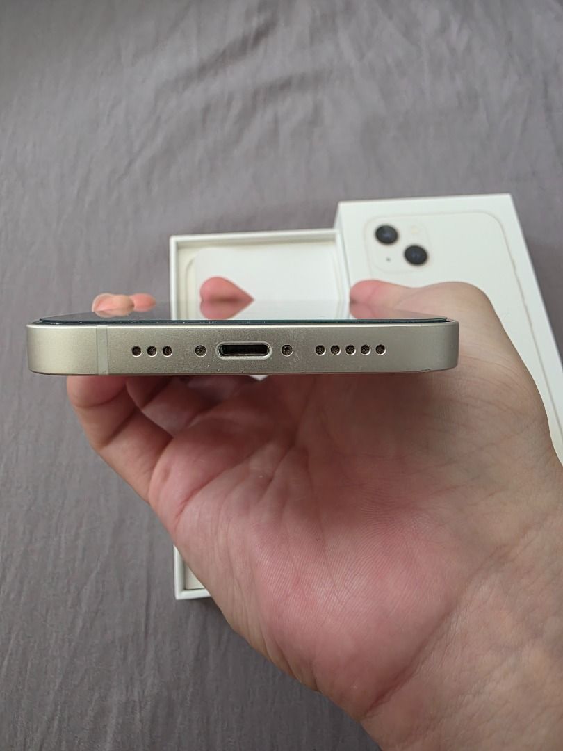 iPhone 13 128gb (Starlight) (Category: iPhone 13 Series) located in Manila. Submitted by av.santiago (Listing ID 1467001762, Image 3). Description: 128gb starlight openline local variant (zp/a) 84 battery health (original) no history of repair Inclusions: * original box * original apple lightning cable * case * ugreen borderless tempered glass cosmetic issues * minor paint chips sa camera ring * tiny dent sa lower right Location: * Sta. Rosa Lagu