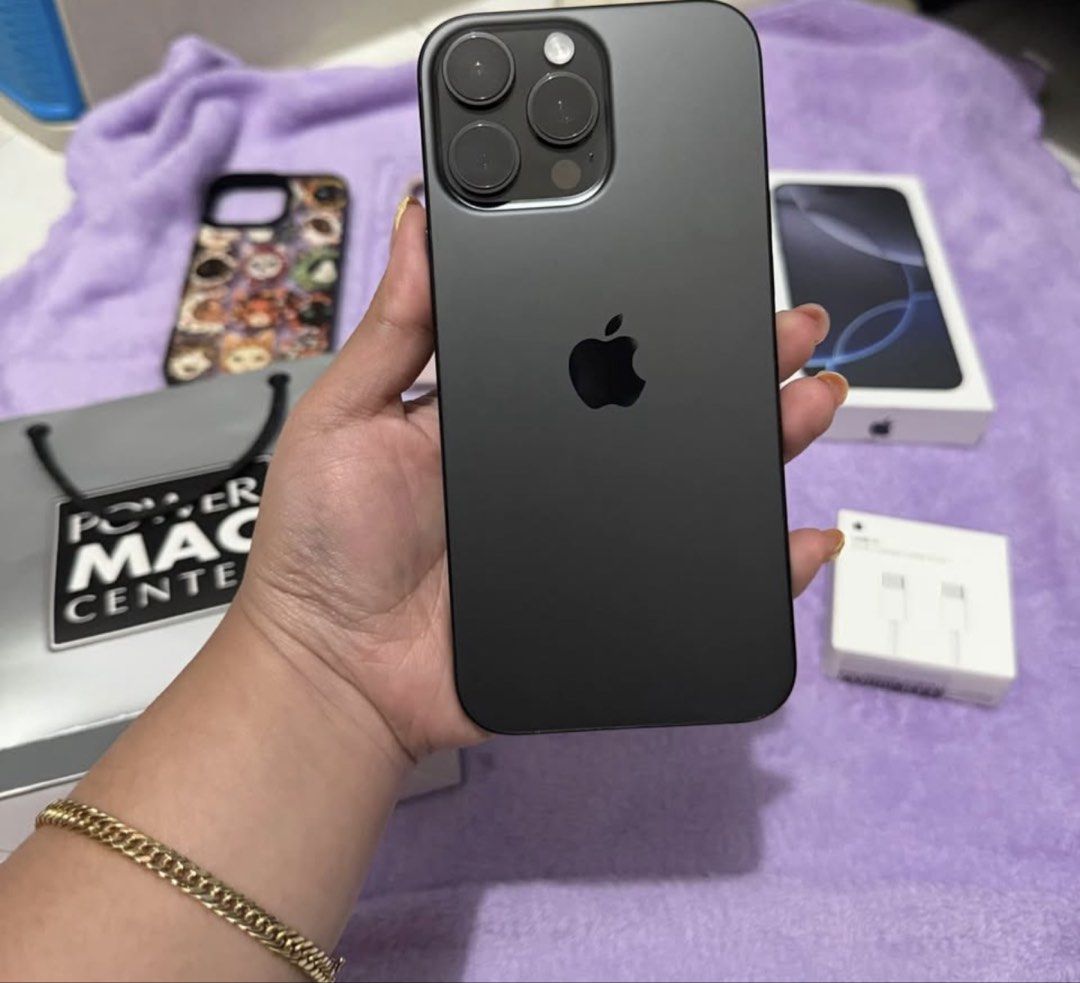 iPhone 16 pro max 256gb (Category: iPhone 16 Series) located in Mandaluyong City. Submitted by dannaaacakes (Listing ID 1467159542, Image 2). Description: selling my personal used phone— iPhone 16 pro max 256gb bought on March 2025 inclusion: original box with same imei pmc paper bag replacement type-c cable + adapter 5 phone cases (other cases not on the pic) canada variant (but physical sim/any sim will do) LL/A RFS: upgraded to 17 pro max alre