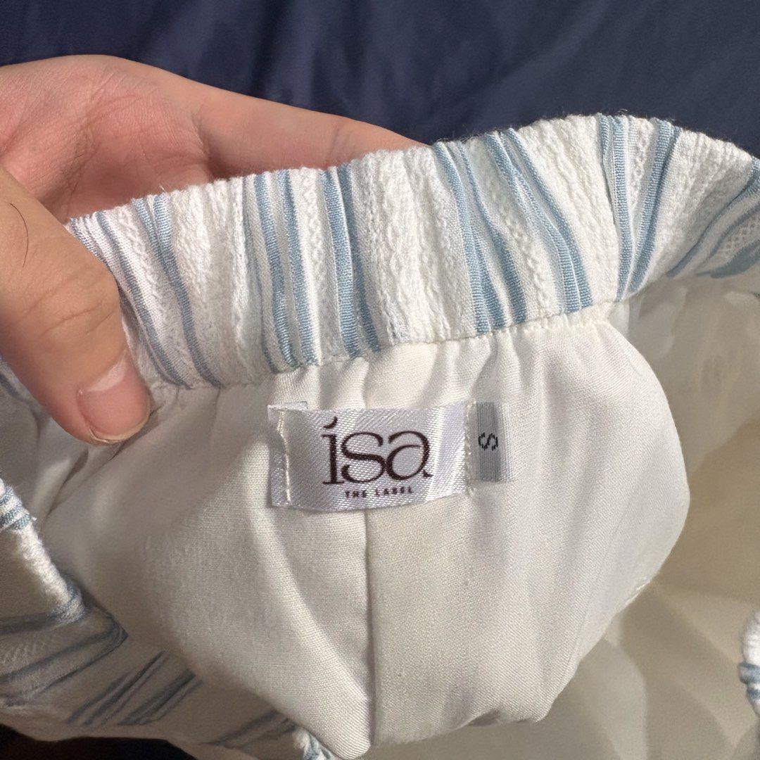 Isa The Label White Linen Pants (Blue) (Category: Jeans) located in Manila. Submitted by mixofsunshine_ (Listing ID 1467012364, Image 3). Description: - Brand: Isa The Label - Brand New - Size: Small - Color/Pattern: White with light blue vertical stripes - Fit: Relaxed wide-leg with elastic waistband - GCASH / MAYA - Lalamove / Grab.