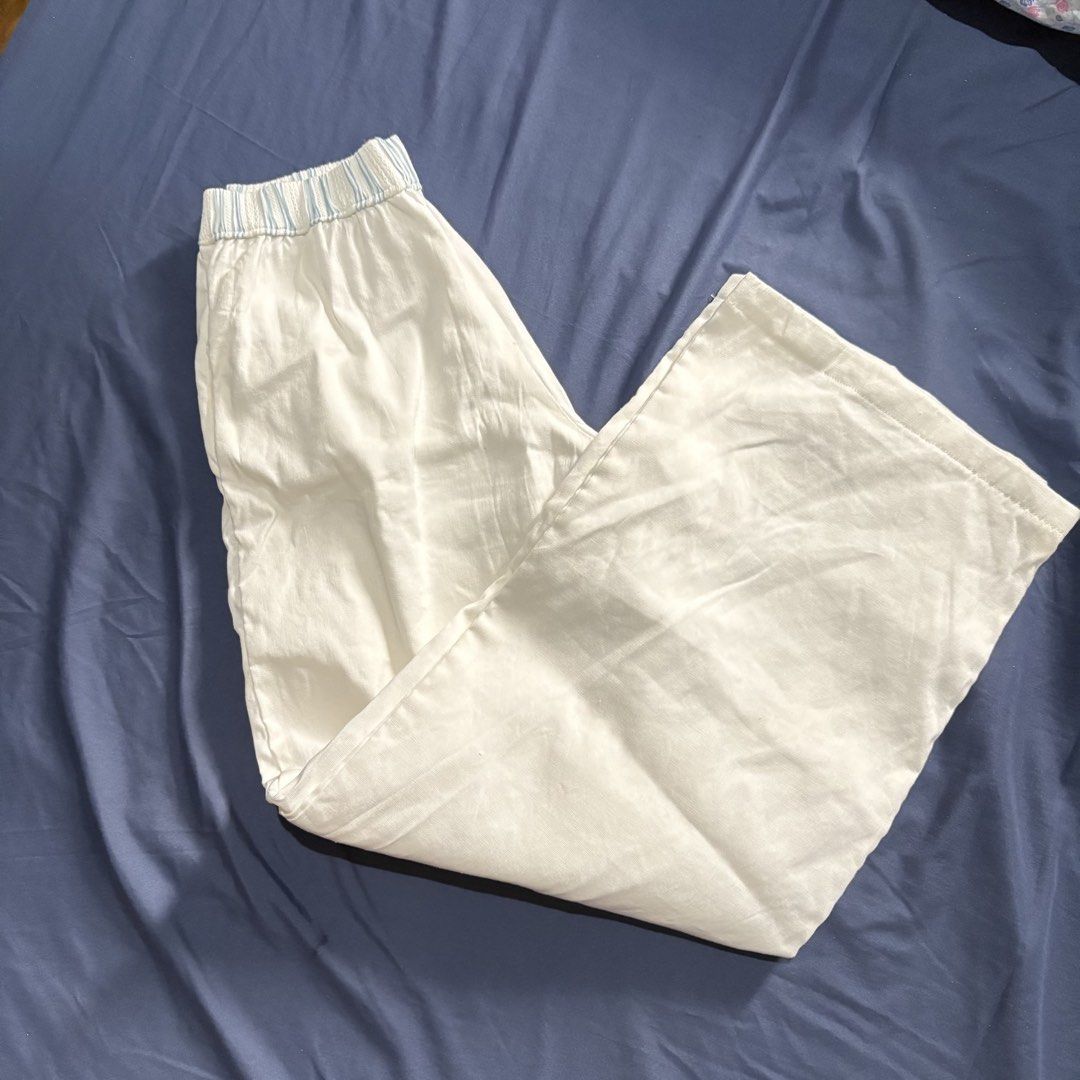Isa The Label White Linen Pants (Blue) (Category: Jeans) located in Manila. Submitted by mixofsunshine_ (Listing ID 1467012364, Image 2). Description: - Brand: Isa The Label - Brand New - Size: Small - Color/Pattern: White with light blue vertical stripes - Fit: Relaxed wide-leg with elastic waistband - GCASH / MAYA - Lalamove / Grab.