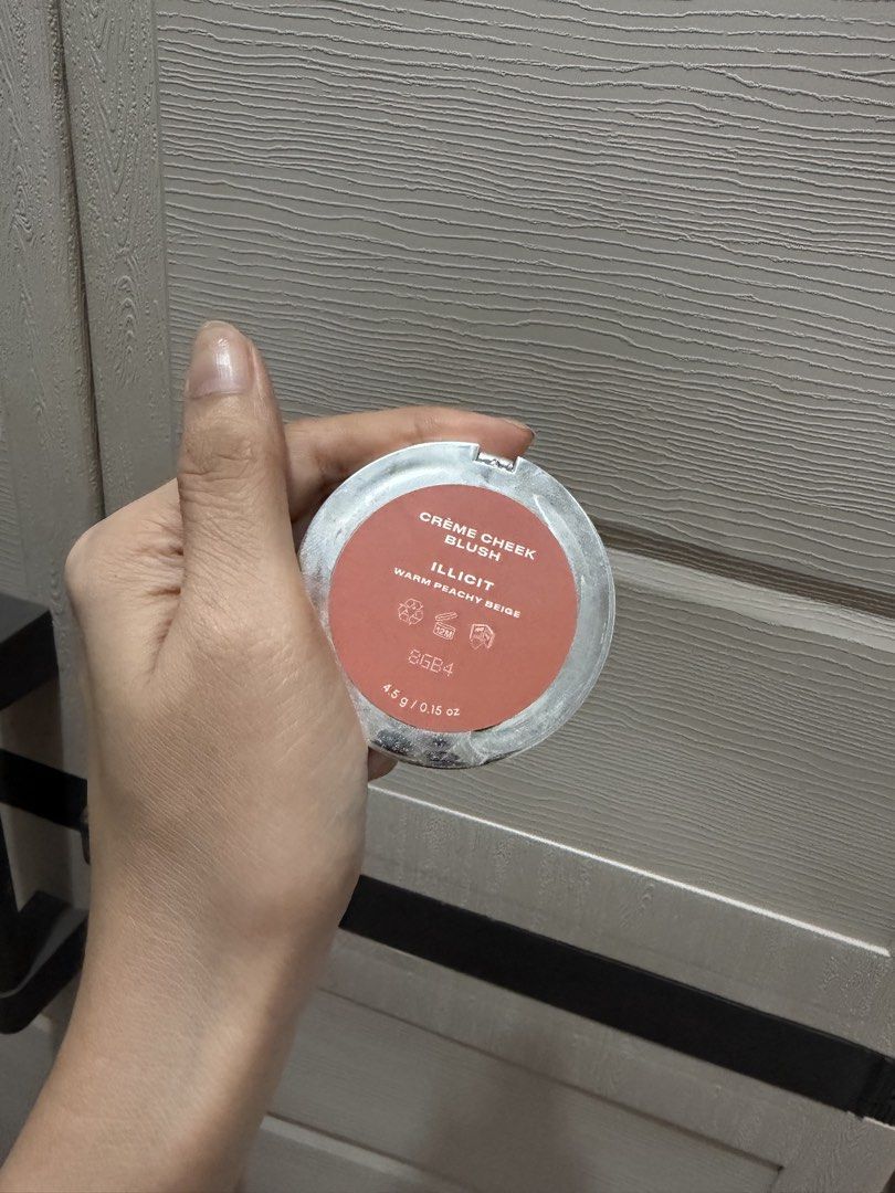 Issy Creme Cheek Blush in Illicit (Category: Makeup) located in Davao. Submitted by fabdeclutter (Listing ID 1467164300, Image 3). Description: - Brand: Issy - Product: Creme Cheek Blush - Shade: Illicit (warm peachy beige) - Size: 4.5g in silver compact with built-in mirror - Usage: Used a few times, still has plenty of product left - Formula: Creamy, highly blendable on skin - Reason for selling: Decluttering similar shades from my collection.