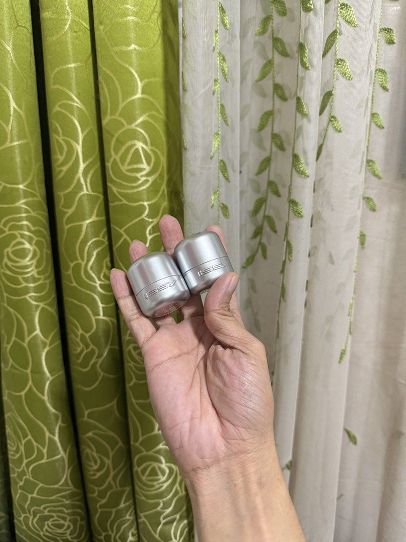 ISSY makeup pods (Category: Makeup) located in Manila. Submitted by misstiffany28 (Listing ID 1467139576, Image 1). Description: - Set of 2 ISSY containers in sleek silver - Small round pods featuring embossed branding - Creme shadow stick (snatch) - Creme flush stick (cowgirl) - Fits standard size makeup items - Clean condition with no major scratches or dents - Selling both together as a bundle.