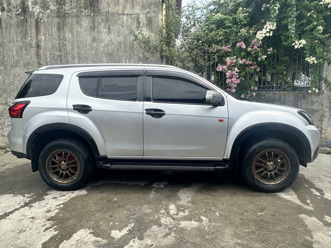 Isuzu Mu-X (Category: Used Cars) located in Manila. Submitted by linomer (Listing ID 1467142311, Image 1). Description: ISUZU MUX 2017 2.5 LS Manual trasmission. 77K Odometer orig mileage Silver metallic Upgrades: OCC worth 7k Front gril worth 10k Foglight with DRL Mags and tires 70K New Tires 2025 DOT bridgestone Venum mags Orig Roofrail Black Spoiler Garnish Side fender Window visor Undercoat last June 2026 Appearance: Some minor scratches plea