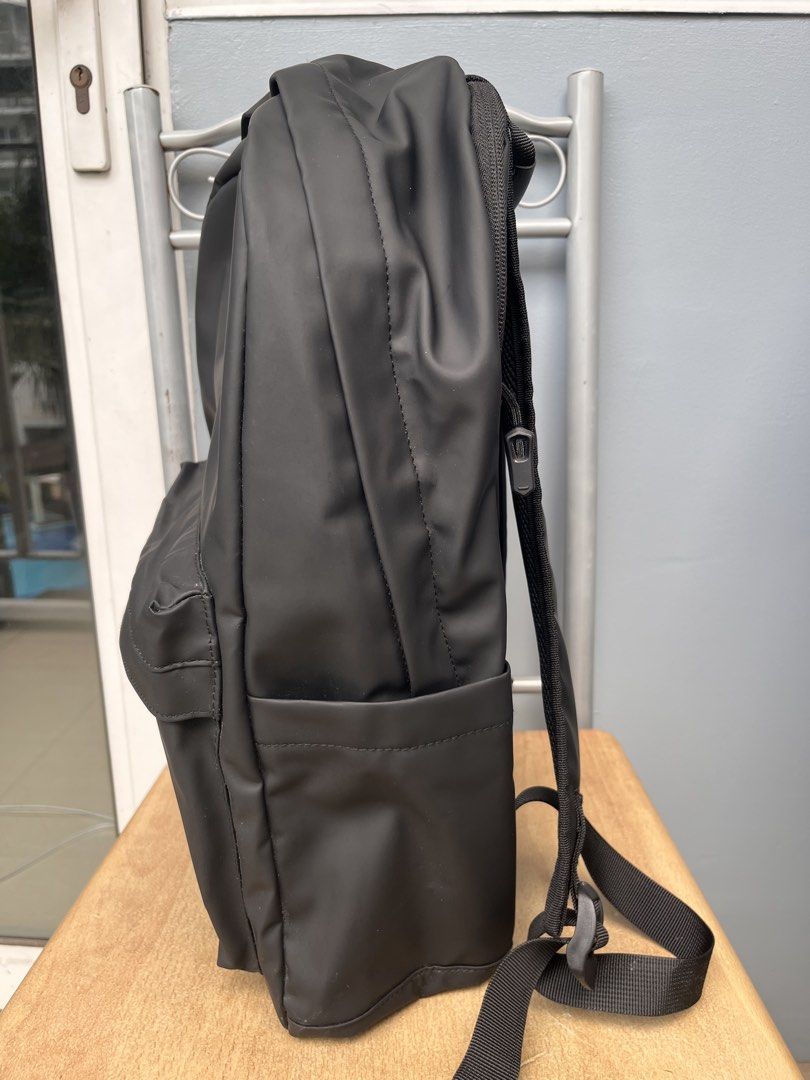 Jack Daniel's Black Waterproof Backpack (Category: Backpacks) located in Pasay City. Submitted by wear.id (Listing ID 1467155977, Image 2). Description: Jack Daniel's Backpack w/ luggage sleeve - color: solid black with smooth matte finish - stitched logo branding on the front pocket - double zipper main compartment and exterior front pouch with clean interior lining - adjustable shoulder straps - brand new / excellent quality.