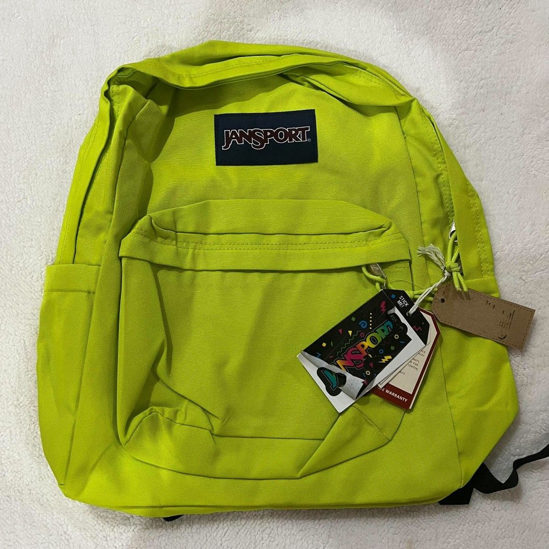 JanSport Backpack Assorted Colors and Patterns Available (Category: Backpacks) located in Mangaldan. Submitted by ice_thrift_hub (Listing ID 1467161909, Image 2). Description: - Authentic JanSport backpacks with original tags attached - Available colors & patterns: Solid purple, neon yellow, black, light grey, and blue/white stripe with banana print - Features a handy front zippered pocket for extra storage - Versatile and durable, great for scho