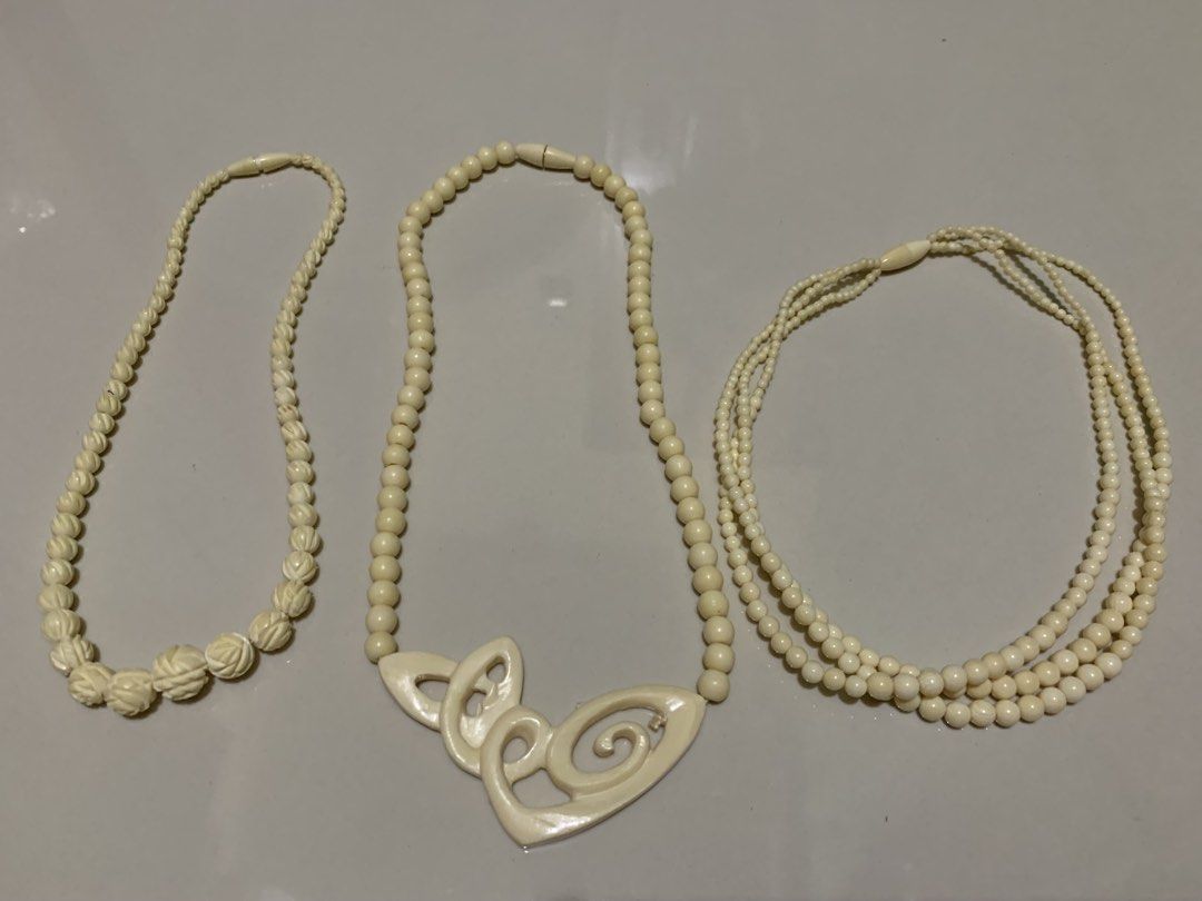 Japan ivory bundle (Category: Necklaces) located in Quezon City. Submitted by ncjnc (Listing ID 1467012133, Image 1). Description: - Bundle of 3 stylish cream-colored vintage bead necklaces - Left piece: Carved twisted beads graduating in size - Middle piece: Features a larger, intricate carved pendant design - Right piece: Delicate 4-strand design with small round beads - Secure clasps at the back - Great statement pieces for elevating everyday 