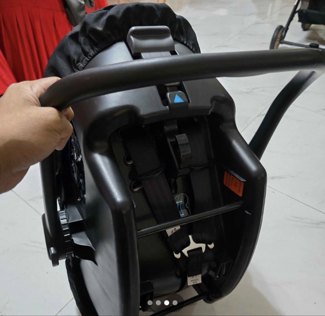 Joie Infant Car Seat Black (Category: Car Seats) located in Pasig City. Submitted by artemissk (Listing ID 1467152897, Image 1). Description: - Brand/Model: Joie baby car seat - Color: Solid black with clean fabric upholstery - Type: Rear-facing infant carrier style - Safety & Comfort: Built-in harness straps with shoulder pads and removable head support insert - Features: Adjustable carry handle and standard safety warnings on the side - Conditi