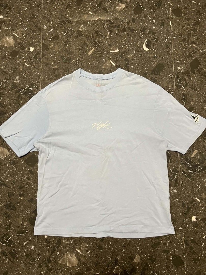 JORDAN FLIGHT LIGHT BLUE TEE (Category: Tshirts & Polo Shirts ) located in San Fernando. Submitted by _jaximus (Listing ID 1467140364, Image 1). Description: - Brand: Jordan Flight - Color: Light Blue - Size: Men's XL (Chest: 105cm) - Material: 100% Cotton - Fit: Regular fit - Details: Embroidered Flight script logo on chest and Jordan patch on left sleeve - Condition: Clean and comfortable everyday tee.