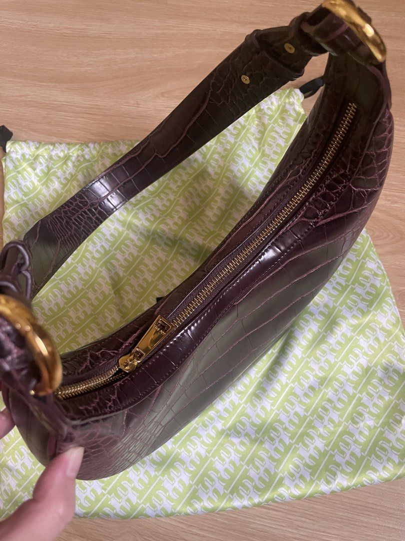 JW Pei Carly Saddle Bag - Brown Croc Embossed (Category: Shoulder Bags) located in Manila. Submitted by angeliquev16 (Listing ID 1467066103, Image 3). Description: - Brand/Model: JW Pei Carly Saddle Bag - Material: Dark brown croc-embossed vegan leather - Design: Crescent shape with gold-tone hardware and top zip closure - Interior: Brown fabric lining with one zip pocket and brand patch - Inclusions: Original lime green branded dust bag - Condit