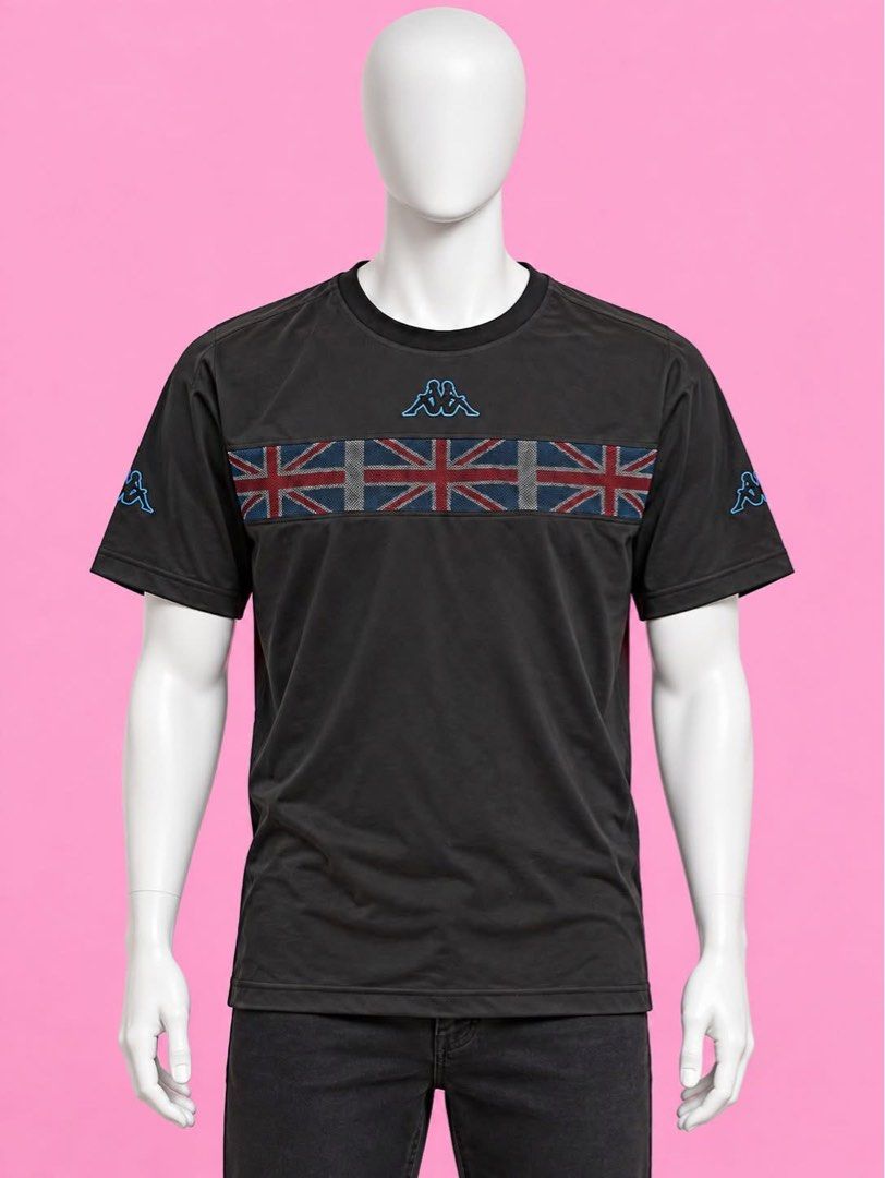 Kappa (Category: Tshirts & Polo Shirts ) located in Manila. Submitted by chelle_thrifted_shack (Listing ID 1467005366, Image 3). Description: - Brand: Kappa - Color: Black - Size: L - Design: Embroidered blue logo on chest and sleeves with a Union Jack flag band across the front - Fit: Standard fit, short sleeves - Condition: Clean, excellent pre-loved condition with no flaws.
