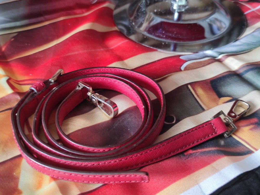 Kate Spade Red Saffiano Leather Satchel (Category: Luxury Bags & Wallets) located in Dagupan City. Submitted by jhazrightshop (Listing ID 1467055267, Image 3). Description: - Brand: Kate Spade - Material: Structured saffiano leather in a bright red shade - Hardware: Elegant gold-tone accents - Versatile Carry: Dual top handles and a detachable matching shoulder strap for crossbody wear - Closure: Secure zip-top closure - Condition: Clean exterior