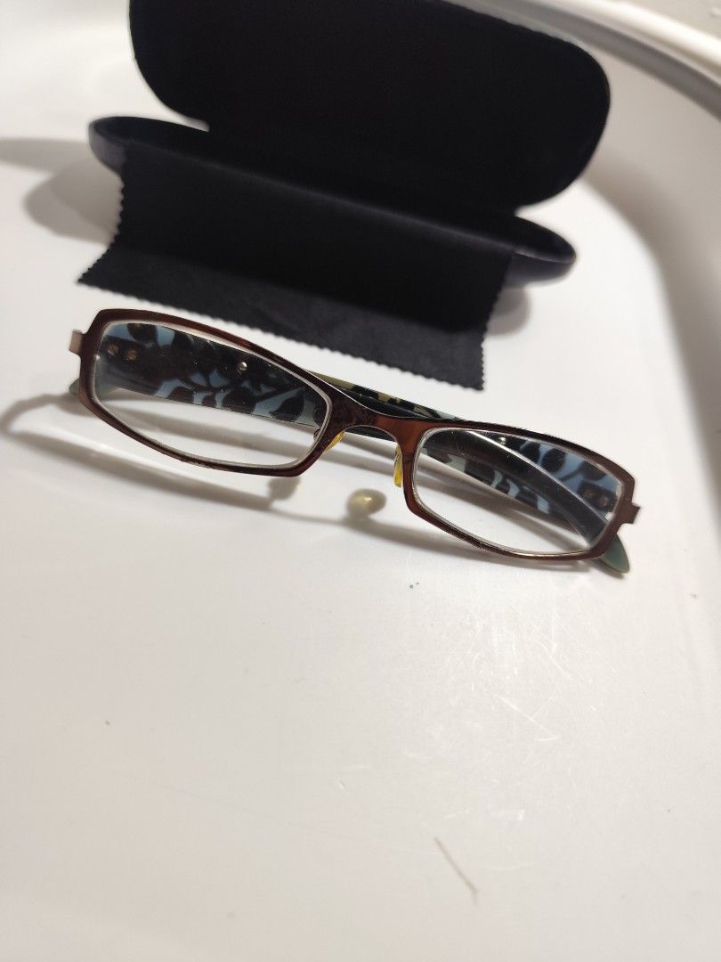 Kenzo Eyeglasses Floral Pattern Frame (Category: Sunglasses & Eyewear) located in Cebu City. Submitted by icoolectnsellect (Listing ID 1467147374, Image 1). Description: FREE if you avail a total of 1500. Issue: paint sa front parang may bubbles na, RX lens. Bought at Garage Sale. Authenticity not Guaranteed, di ko alam if legit or Fake. Buy @ your own Risk. All EyeGlasses or Sun Glasses ay may Grado or Prescription Glasses. Please be careful par