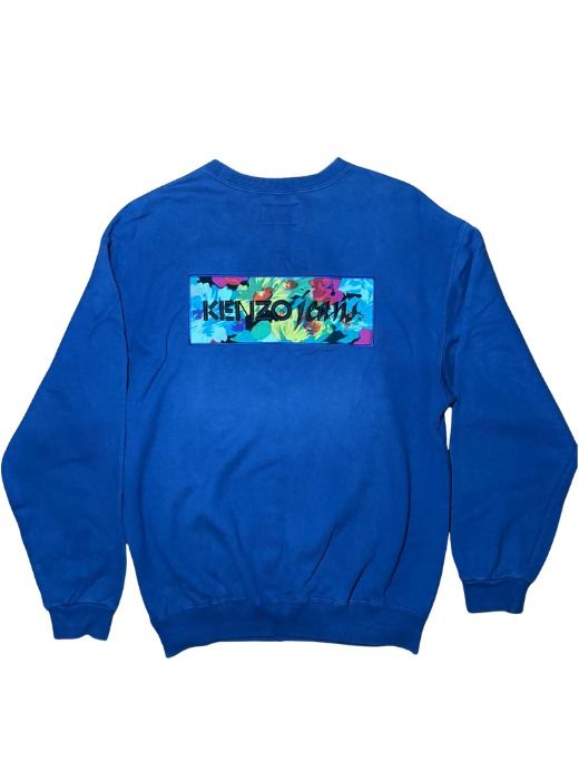 Kenzo Jeans Blue Floral Patchwork Logo Sweatshirt (Category: Coats, Jackets and Outerwear) located in Marikina City. Submitted by maobuysstuff (Listing ID 1467011135, Image 1). Description: Kenzo Jeans Blue Sweater - Vibrant floral print rectangular patch with black embroidered logo on the back - Medium fit - 21.5" x 26.5" - Condition: Excellent.