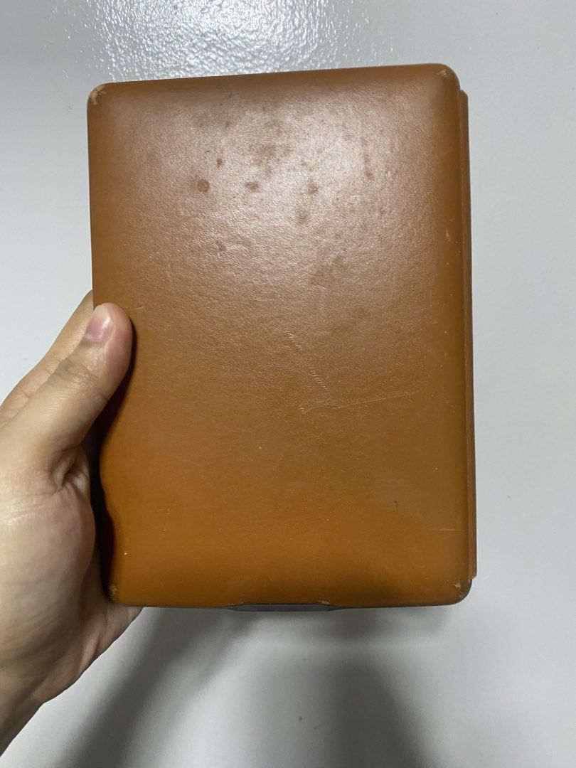 Kindle E-Reader 4th Generation (Category: E-Readers) located in Pasacao. Submitted by wengpullar37205 (Listing ID 1467127999, Image 2). Description: - Brand/Model: Kindle 4th Generation E-Reader - Includes a protective brown case with visible wear from normal use - Features physical navigation buttons and e-ink screen for comfortable reading - Compact, lightweight, and easy to carry around - Fresh from the box working nmn po,ku na magkalikot -Don