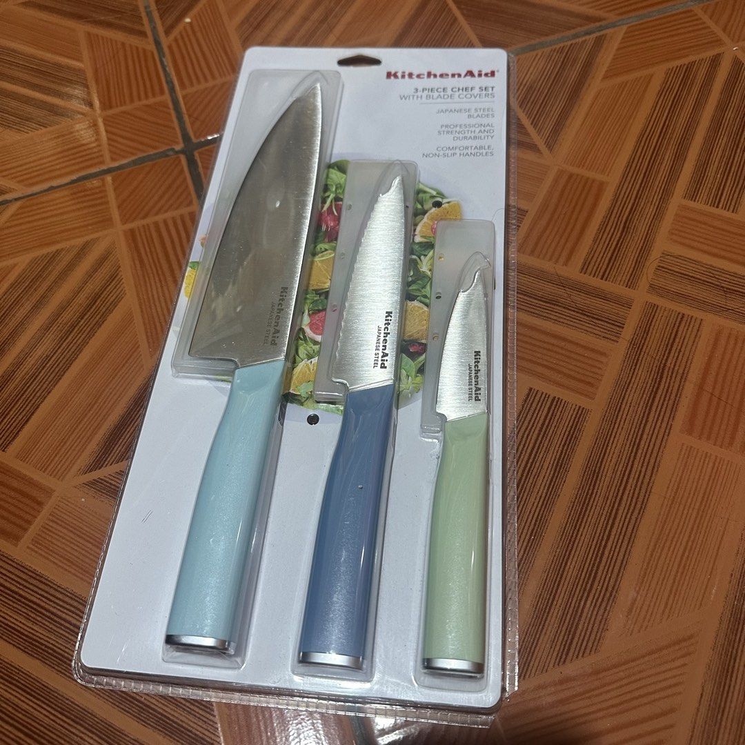 KitchenAid 3-Piece Chef Knife Set with Blade Covers (Category: Knives & Chopping Boards) located in Pasig City. Submitted by angelagigante (Listing ID 1466988899, Image 2). Description: - Brand: KitchenAid 3-piece knife set - Includes: Chef knife, utility knife, and paring knife - Material: Professional-strength Japanese steel blades - Handles: Comfortable nonslip pastel handles (light blue, dusty blue, and light green) - Extras: Includes protect