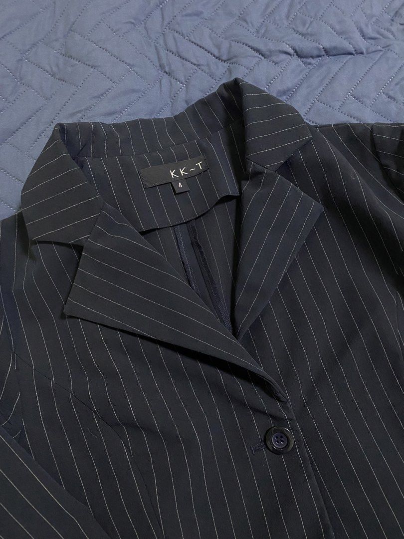 KK-T Striped Blazer Size 4 (Category: Coats, Jackets and Outerwear) located in Manila. Submitted by escherichiaa (Listing ID 1467126602, Image 2). Description: - Brand: KK-T - Size: 4 - Color/Pattern: Black with white vertical pinstripes - Style: Structured lapel collar, front button closures, tailored waist - Condition: Excellent, clean fabric with no stains or loose threads - Ideal for: Office wear, business casual, and formal events.