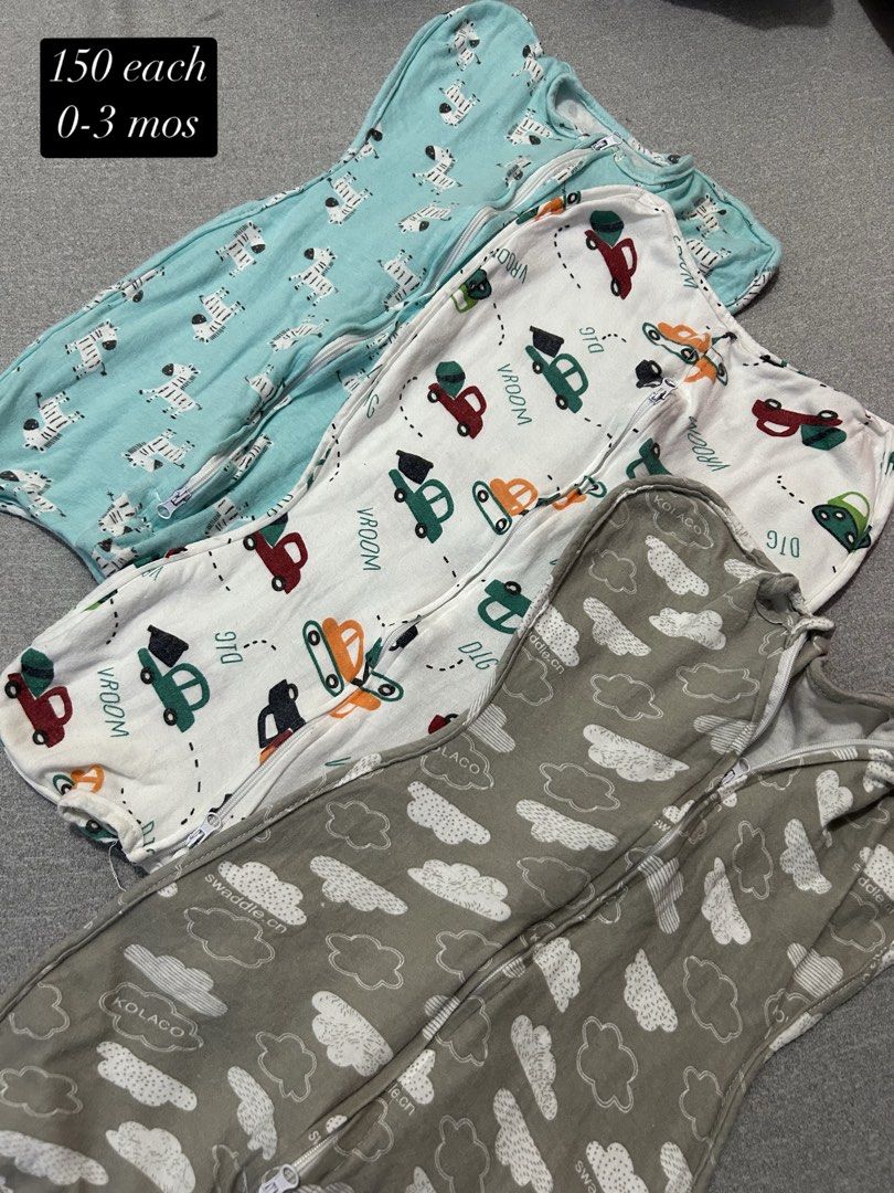 Kolaco Baby Swaddle 0-3 Months Assorted Designs (Category: Babies & Kids Fashion) located in Manila. Submitted by katrinamae15 (Listing ID 1467140852, Image 2). Description: - Brand: Kolaco baby swaddles - Size: 0 to 3 months - Design: Convenient zipper closure for a snug, cozy sleep - Prints: 6 adorable designs available (safari animals, cars, clouds) - Price: ₱150 each - Note: Choose your favorite pattern or grab the complete set!.