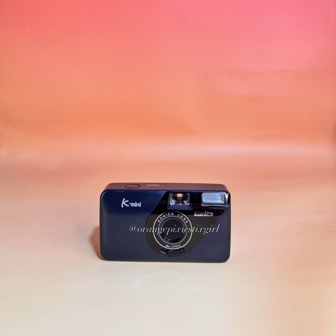 Konica K-mini 35mm Compact Film Camera (Category: Cameras) located in Bulacan. Submitted by orangepixiestixgirl (Listing ID 1467164598, Image 1). Description: ‼️message me on ig, @orangepixiestixgirl for inquiries and transactions‼️ ‼️CAN’T REPLY HERE‼️ Konica K-mini 35mm Film Camera —Fixed Konica 28mm f/6.7 lens. —Fixed-focus (pan-focus) system, meaning everything from about 1.2 meters to infinity is kept reasonably sharp without needing autofoc