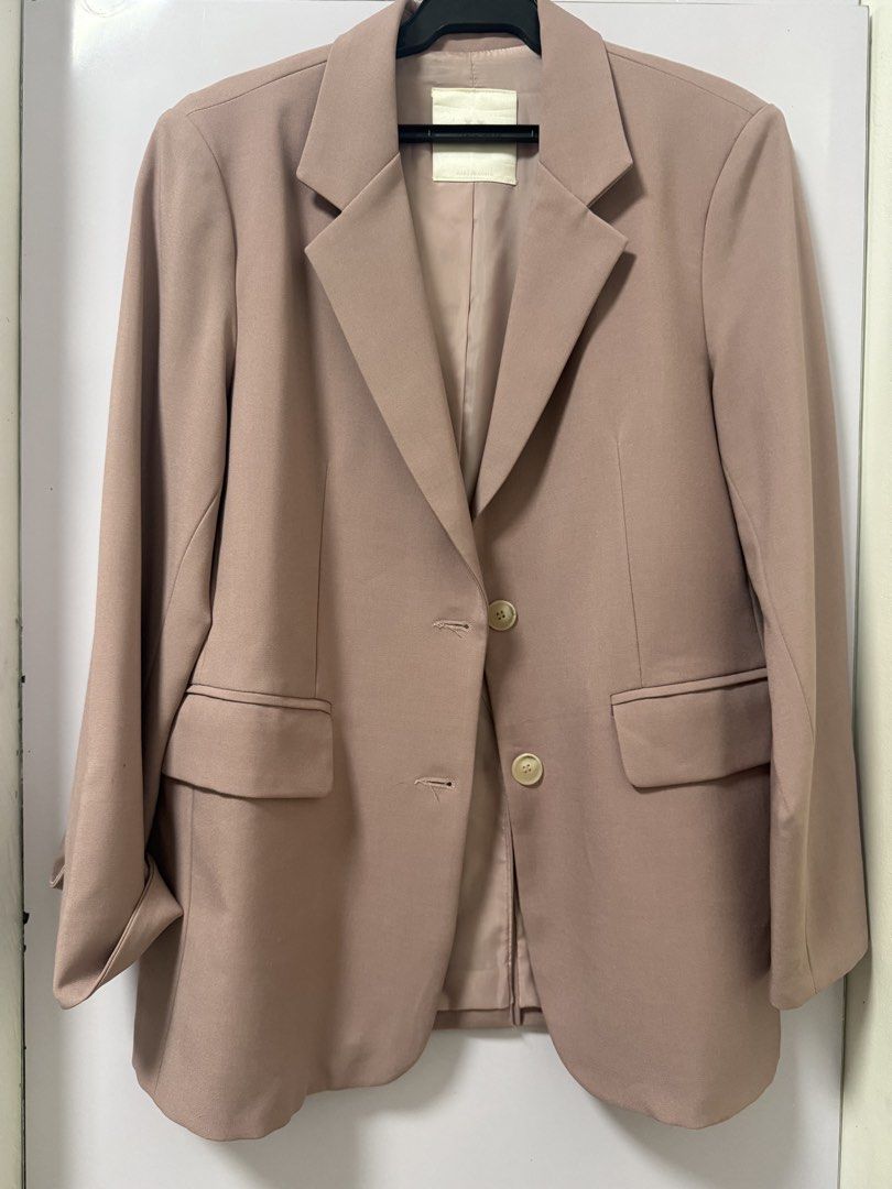 Korean Style Taupe Oversized Blazer Jacket (Category: Coats, Jackets and Outerwear) located in Quezon City. Submitted by lovedbymaxandmikoy (Listing ID 1466975083, Image 1). Description: - Style: Oversized taupe blazer, perfect for work or casual layering - Fit: Relaxed, classic neutral tone that matches everything - Details: Structured lapel collar, two front button closures, two front flap pockets - Interior: Fully lined for comfort - Origin: M