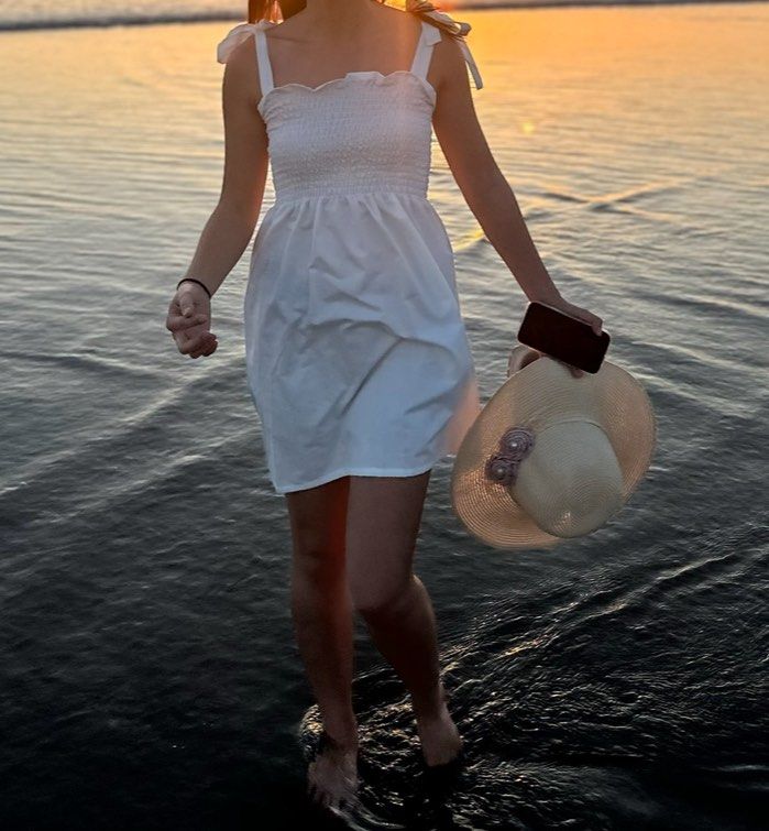 La Coco Babe White Smocked Sundress with Tie Straps (Category: Dresses) located in Caloocan City. Submitted by nikkiepie704949 (Listing ID 1466975264, Image 2). Description: - Brand: La Coco Babe - Color: White - Style: Sleeveless sundress with flared skirt hitting above the knee - Details: Stretchy smocked bodice and cute adjustable tie straps - Fabric: Super breezy and lightweight, perfect for warm weather.