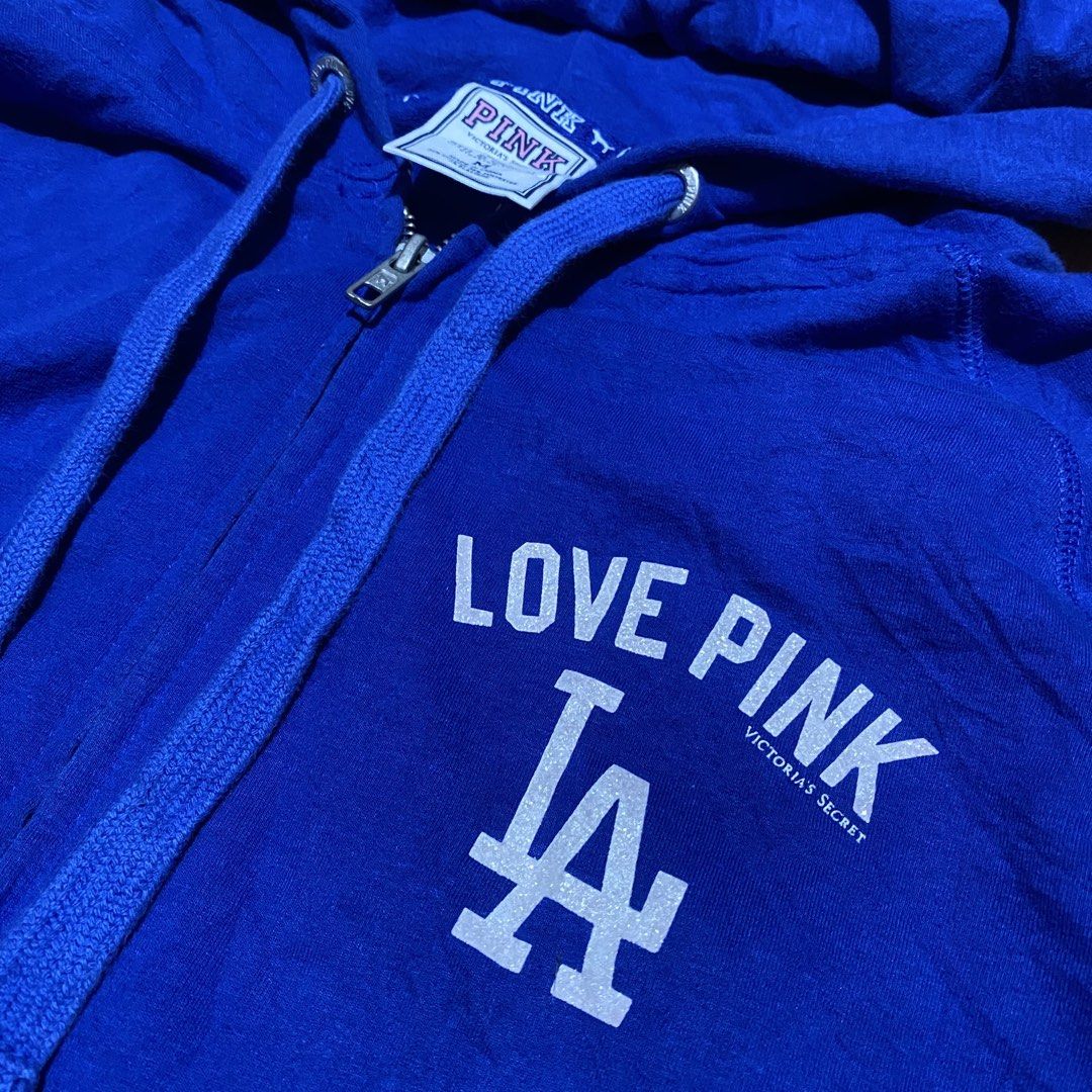 LA DODGERS CROP HOOD BY PINK (Category: Coats, Jackets and Outerwear) located in Manila. Submitted by killthismane (Listing ID 1467095603, Image 2). Description: Victoria’s Secret PINK x MLB Los Angeles Dodgers zip-up hoodie featuring “LOVE PINK” and the Dodgers “LA” logo on the chest with backhit. SIZE M (18/20).