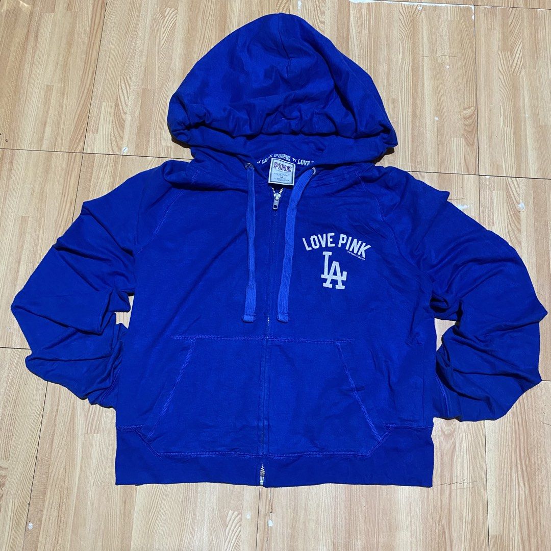 LA DODGERS CROP HOOD BY PINK (Category: Coats, Jackets and Outerwear) located in Manila. Submitted by killthismane (Listing ID 1467095603, Image 1). Description: Victoria’s Secret PINK x MLB Los Angeles Dodgers zip-up hoodie featuring “LOVE PINK” and the Dodgers “LA” logo on the chest with backhit. SIZE M (18/20).