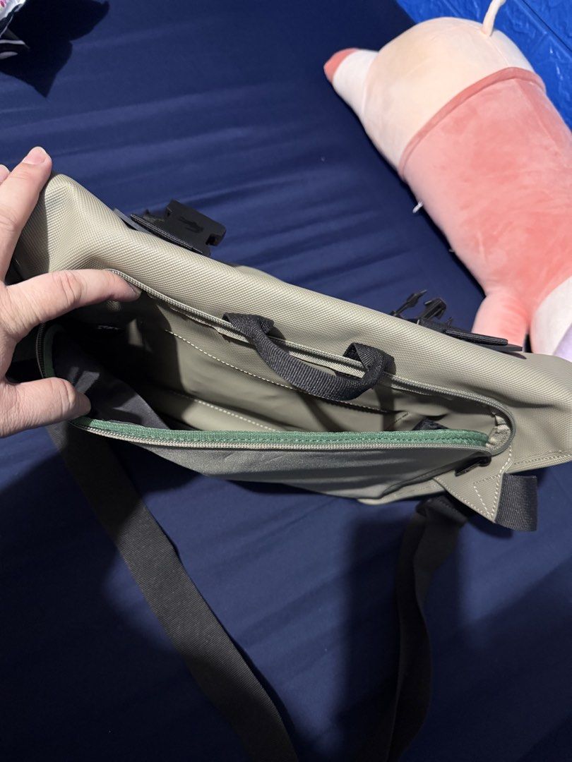 Lacoste Eco Kelp Messenger Bag (Category: Sling Bags) located in Paranaque City. Submitted by doc.k8 (Listing ID 1467159012, Image 3). Description: - Brand: Lacoste - Style: Messenger Bag / Daily Carry - Color: Olive Green with Black Strap - Material: 100% Durable Polyester Canvas - Closure: Dual buckle front flap - Interior: Dark grey lining with zippered pocket and Lacoste patch tag - Condition: Clean interior and exterior, excellent practical 