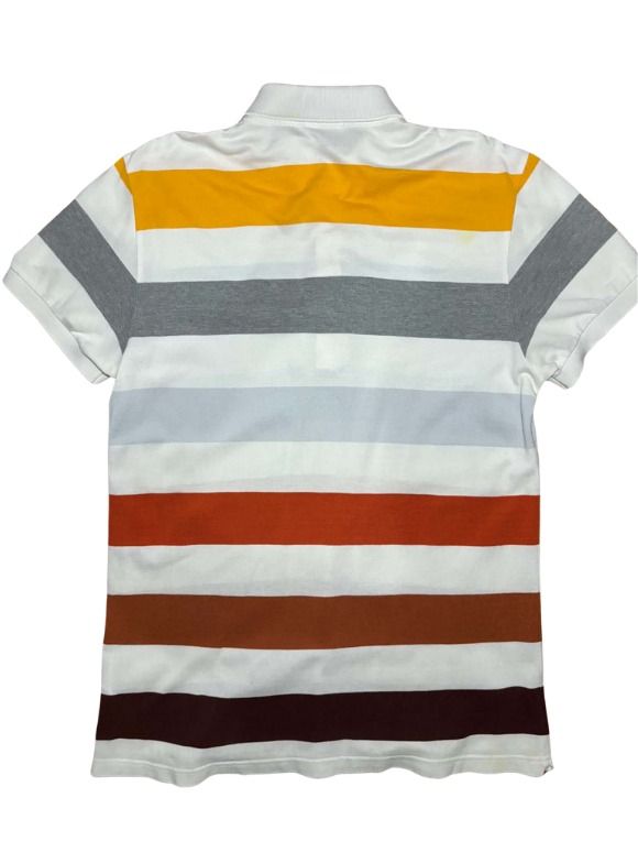 Lacoste Multi-Color Striped Polo Shirt (Category: Tshirts & Polo Shirts ) located in Marikina City. Submitted by maobuysstuff (Listing ID 1467012814, Image 2). Description: Lacoste Multi-Color Striped Polo Shirt - Style: Horizontal striped polo shirt (white, yellow, grey, light blue, rust orange) - Fits Small-Medium - 18" x 27" - Details: White ribbed collar, 3 mother-of-pearl buttons, iconic embroidered green crocodile logo - Flaw: Slight yellow