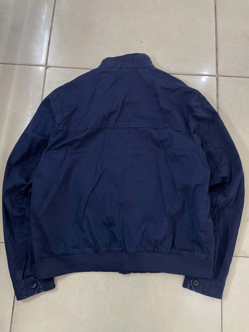 Lacoste Navy Blue Zip Up Jacket (Category: Coats, Jackets and Outerwear) located in Cainta. Submitted by mariss.luxx (Listing ID 1467093021, Image 2). Description: - Brand: Lacoste - Color: Navy Blue - Size: French 54 / US Large - Measurements: 24.5" (pit to pit) x 27" (length) - Design: Zip-up with stand collar and striped inner lining - Details: Side pockets, adjustable button ribbed cuffs, and classic embroidered chest crocodile logo - Conditi