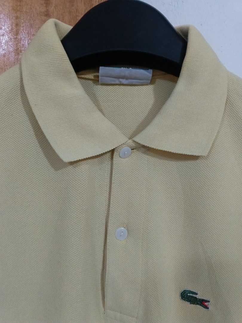 Lacoste Polo Shirt (Category: Tshirts & Polo Shirts ) located in Cebu City. Submitted by authenticgrids (Listing ID 1467124776, Image 3). Description: Lacoste Polo Shirt Light Yellow color Color Rate 10/10 Condition 10/10 Like new 💯 Issue/s: None Size on Tag 🏷️ XL Width 22 inches Length 29 inches 📥📥📥📥 DM us for more details.