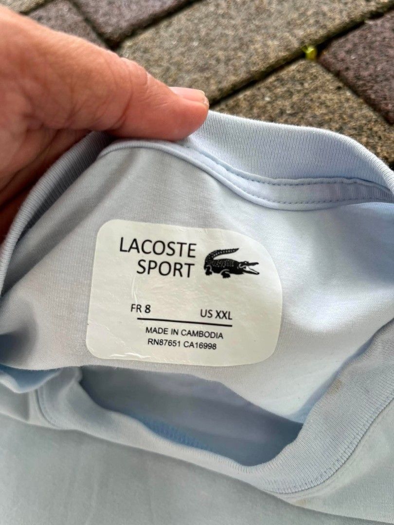 Lacoste Sports (Category: Activewear) located in Davao. Submitted by thriftnijanny (Listing ID 1467157242, Image 3). Description: 📌Lacoste Sports size XXL 21x30 Good Condi Color rate: 9/10 issue: Small Yellow stain on neck part, back and front Check CS for pics.