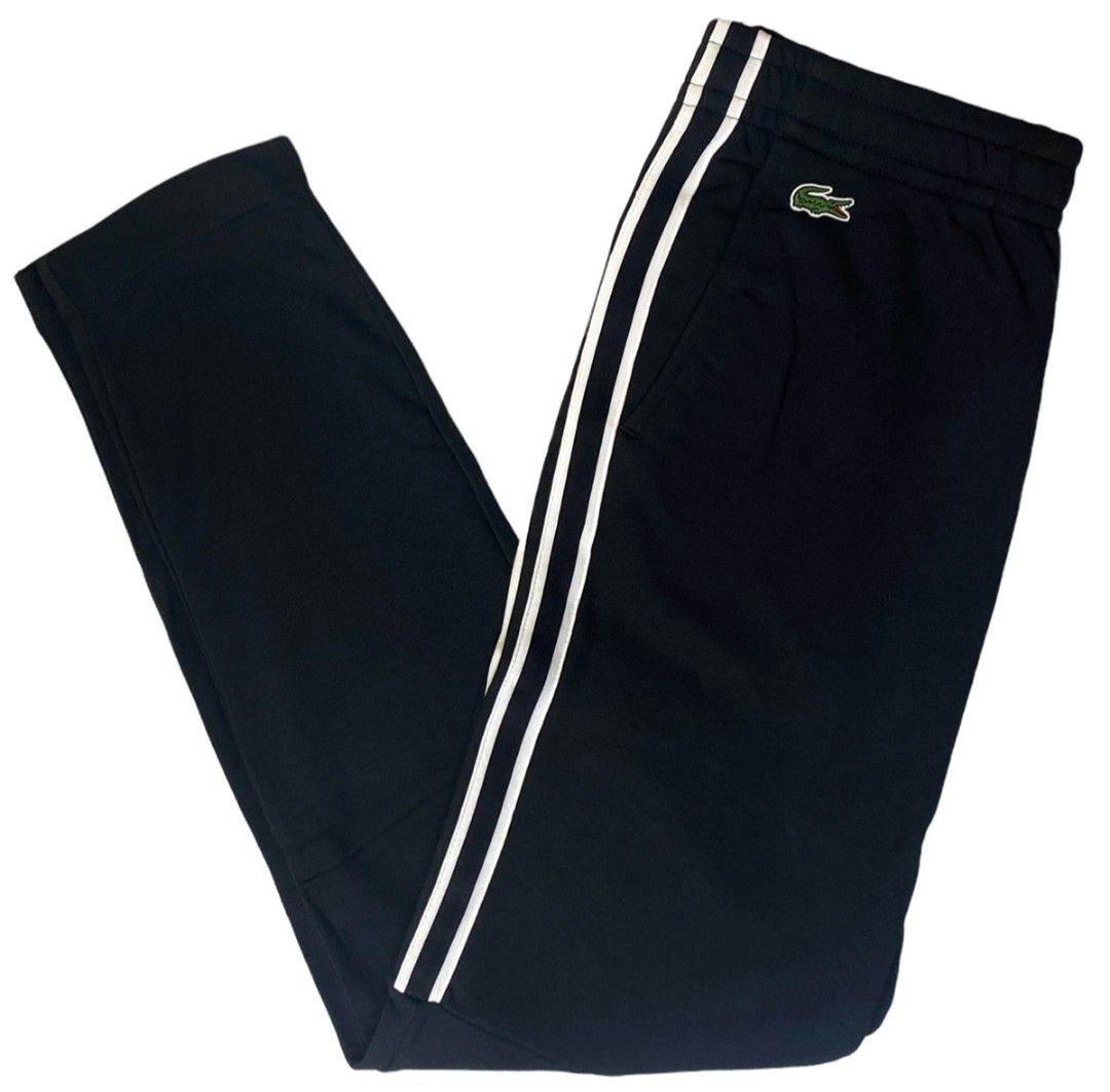 Lacoste Track Pants XH3286 Black Size L (Category: Joggers) located in Quezon City. Submitted by jutang21 (Listing ID 1467059604, Image 1). Description: - Brand: Lacoste - Item: Track Pants -Size 30 to 34W 37L - Color: Black with dual white side stripes - Logo: Embroidered green crocodile near the right pocket - Size: US L / FR 5 - Style Number: XH3286 - Waist: Elastic with drawstring - Condition: Clean inside and out, excellent pre-owned conditi