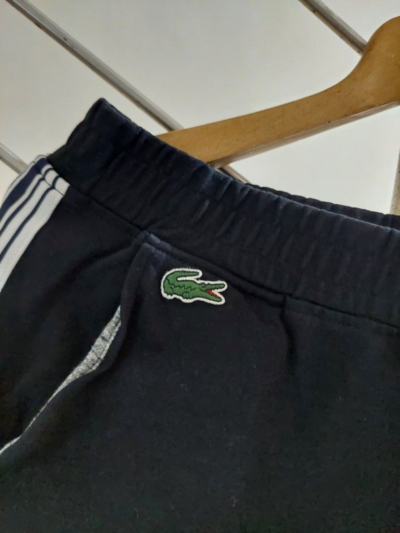 Lacoste Track Pants XH3286 Black Size L (Category: Joggers) located in Quezon City. Submitted by jutang21 (Listing ID 1467059604, Image 3). Description: - Brand: Lacoste - Item: Track Pants -Size 30 to 34W 37L - Color: Black with dual white side stripes - Logo: Embroidered green crocodile near the right pocket - Size: US L / FR 5 - Style Number: XH3286 - Waist: Elastic with drawstring - Condition: Clean inside and out, excellent pre-owned conditi