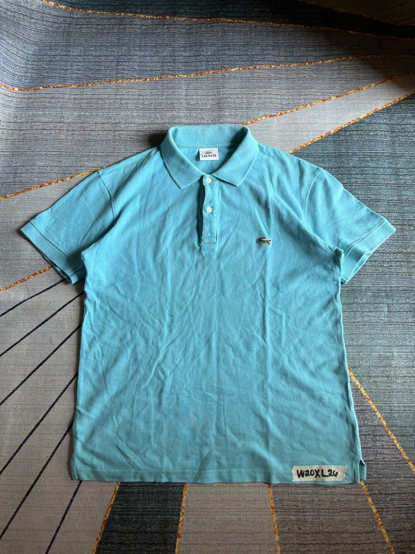 Lacoste Turquoise Polo Shirt Size 4 (Category: Tshirts & Polo Shirts ) located in Puerto Princesa. Submitted by dijaydj28 (Listing ID 1467142221, Image 1). Description: - Brand: Lacoste - Color: Vibrant Turquoise - Size: 4 (Medium) - Material: Breathable cotton pique - Features: Classic collar with 2 white branded buttons, iconic embroidered green crocodile logo, ribbed cuffs and hem - Condition: Clean, well-kept, and in great pre-loved shape - P