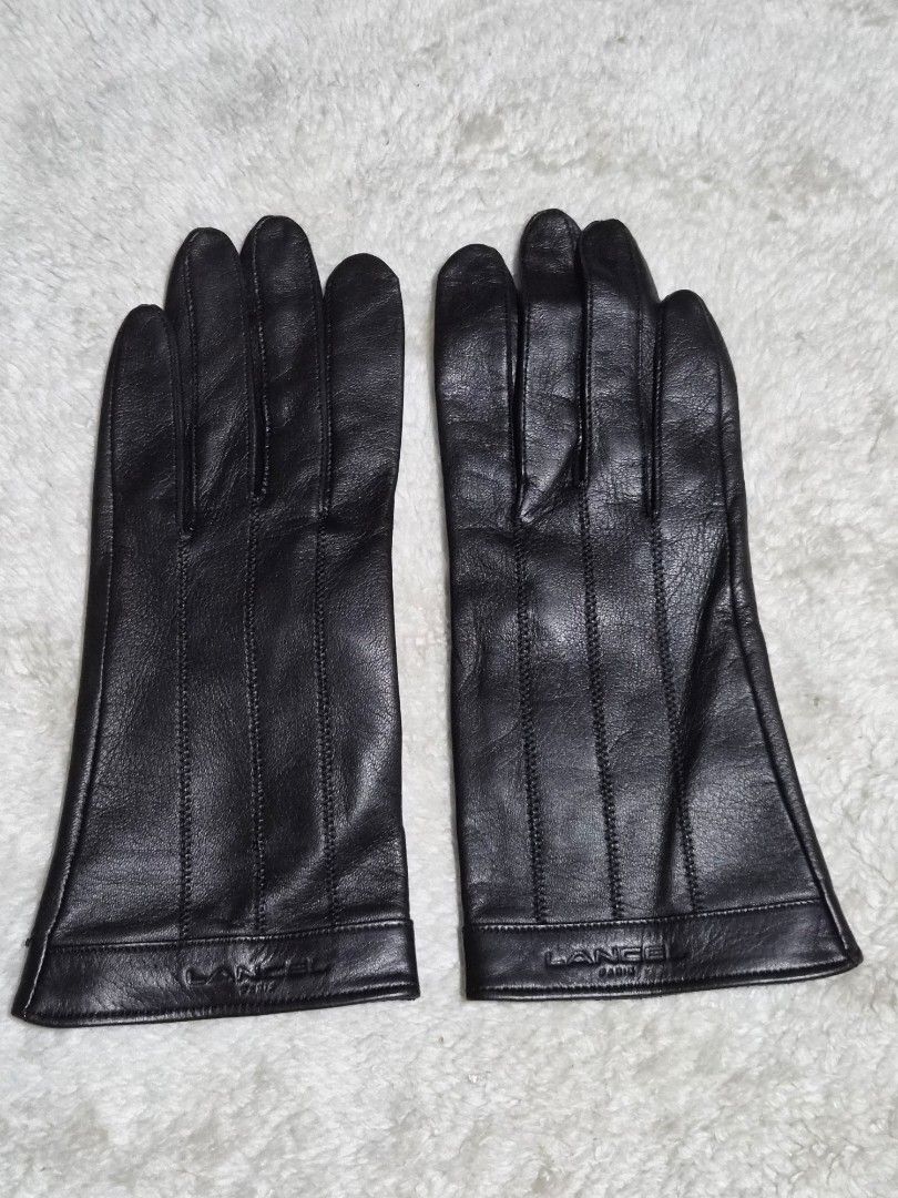 Lancel Paris Black Leather Gloves (Category: Baby Monitors) located in Mandaue City. Submitted by chuchi152615 (Listing ID 1466986497, Image 3). Description: - Brand: Lancel Paris - Material: Premium soft sheepskin leather - Color: Classic Black - Features: Elegant stitched ridges on top and embossed logo stamp near the wrist cuff - Condition: Flawless, clean interior, and no scuffs on fingers - Care: Properly stored in a smoke-free environment.