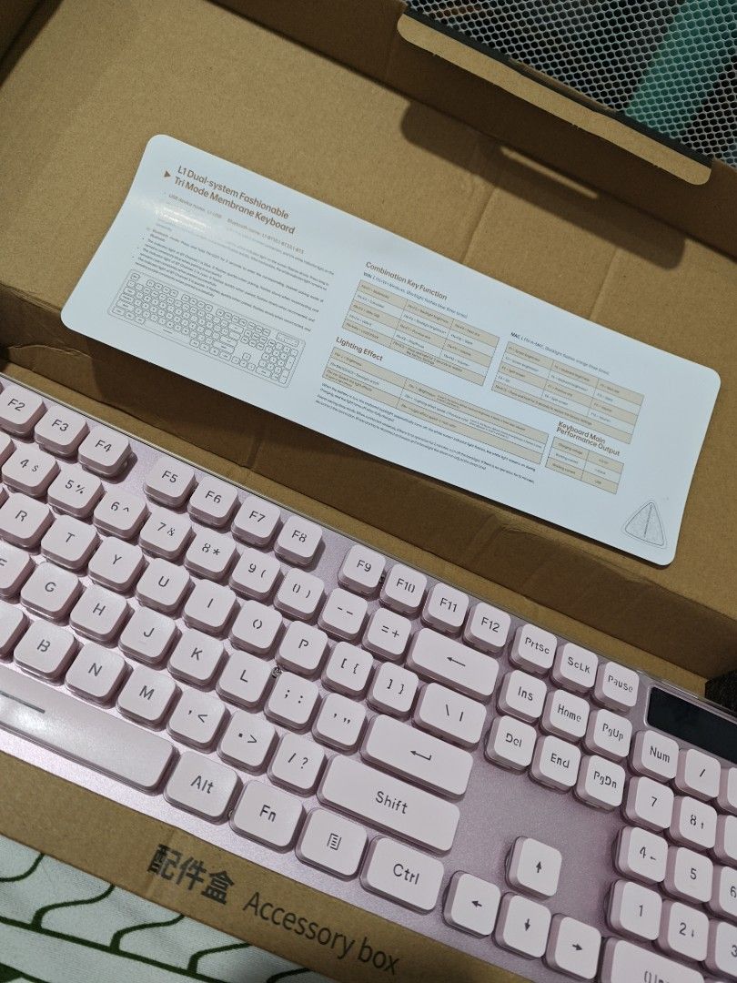 LANGTU L1 Tri-Mode Mechanical Membrane Keyboard Pink (Category: Computer Keyboard) located in Imus. Submitted by jamillabrillantes (Listing ID 1466988123, Image 2). Description: - Model: LANGTU L1 Tri-Mode Membrane Keyboard (Pink) - Connectivity: Wireless and wired options with dual-system support - Lighting: Vibrant RGB backlit keys with multi-color effects - Ergonomics: 15-degree inclined typing angle for comfortable work and gaming - Inclusion