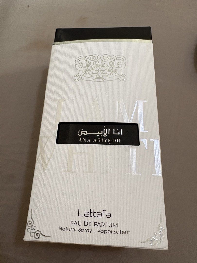 Lattafa Ana Abiyedh Eau De Parfum (Category: Fragrance & Deodorants) located in Binan City. Submitted by dabiescloset (Listing ID 1467015975, Image 1). Description: - Authentic Lattafa Ana Abiyedh Eau de Parfum (100ml, natural spray) - Direct from UAE Middle Eastern fragrance house - Full bottle level visible, comes with original packaging box and holographic authenticity sticker - Features a beautiful bottle with decorative cap details - Perfect