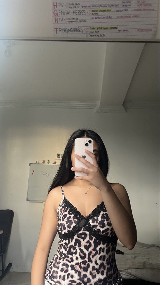 Leopard Print Camisole with Lace Trim (Category: Sleeveless) located in Manila. Submitted by iayo.15 (Listing ID 1467071215, Image 2). Description: - Trendy leopard print camisole - Delicate black lace trim along V-neckline - Thin adjustable straps for a custom fit - Soft material with a snug fit - Versatile: great for layering or as sleepwear - Condition: Worn a few times, freshly washed and properly stored.