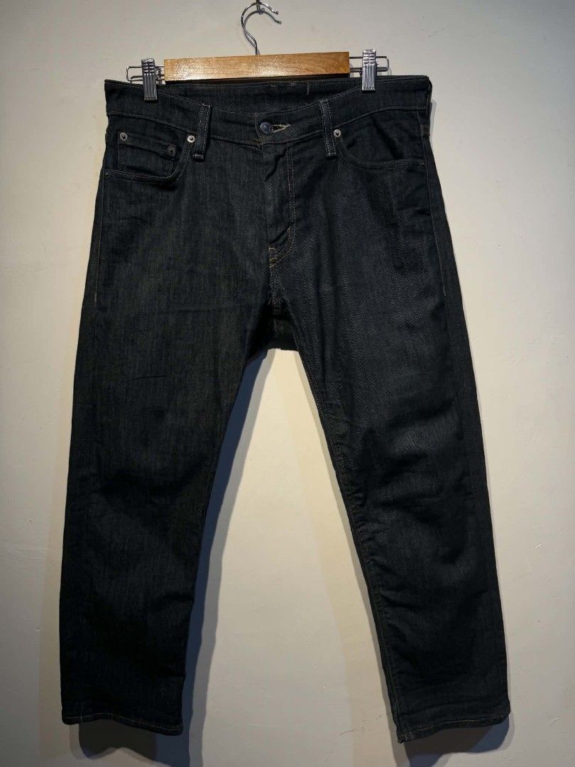 Levi's Dark Wash Denim Jeans (Category: Jeans) located in Carmen. Submitted by kyntmiras_thrift (Listing ID 1467116300, Image 1). Description: - Authentic Levi's dark wash denim jeans - Classic button fly closure with durable metal hardware - Timeless straight leg fit for everyday styling - Signature red tab logo on the back pocket - Genuine leather patch on the rear waistband - Contrast stitching detail throughout - Perfect wardrobe staple, read