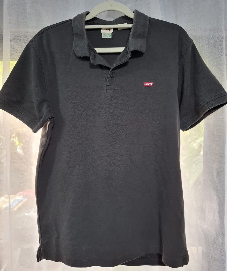 Levi's Gray Polo Shirt Size M (Category: Tshirts & Polo Shirts ) located in Manila. Submitted by jazil.ladyliz (Listing ID 1467044071, Image 2). Description: - Brand: Levi's - Color: Dark Grey / Black - Size: Medium (M) - Material: Premium Cotton Pique - Design: Classic collar, single button placket, short sleeves - Branding: Embroidered red Levi's logo on left chest - Measurements: ~20inches pit-to-pit, ~25 inches length - Condition: Excellent, 