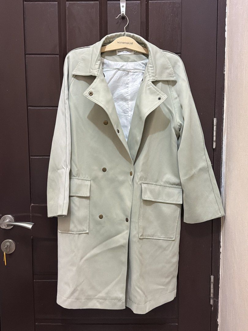Light green double-breasted trench coat with front pockets (Category: Coats, Jackets and Outerwear) located in Cavite. Submitted by jzshoppe (Listing ID 1467128259, Image 1). Description: - Color: Light green - Style: Double-breasted button front with mid-length cut - Features: Two large front pockets, long sleeves, and clean white inner lining - Ideal for: Cooler weather and everyday layering - Condition: Excellent, hangs nicely.