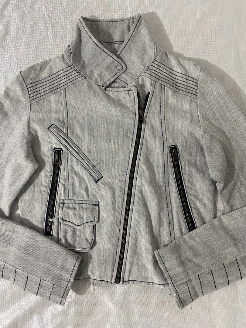 Light Grey Denim Biker / Moto Jacket (Category: Coats, Jackets and Outerwear) located in Baguio. Submitted by sollunathrift13 (Listing ID 1466992011, Image 1). Description: s-m Light Grey Denim Biker / Moto Jacket Color: Light washed grey / ice grey denim Style: Asymmetrical zip-front biker / moto jacket with high collar Fabric & Stitching: Heavyweight cotton denim featuring prominent black contrast topstitching throughout Hardware & Closures: As
