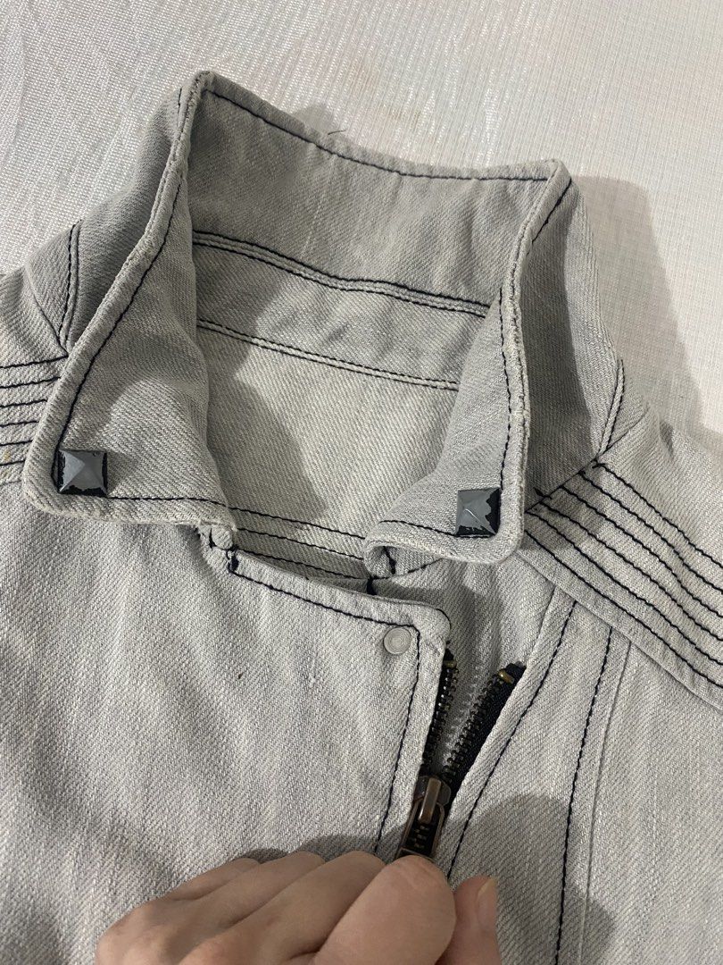 Light Grey Denim Biker / Moto Jacket (Category: Coats, Jackets and Outerwear) located in Baguio. Submitted by sollunathrift13 (Listing ID 1466992011, Image 3). Description: s-m Light Grey Denim Biker / Moto Jacket Color: Light washed grey / ice grey denim Style: Asymmetrical zip-front biker / moto jacket with high collar Fabric & Stitching: Heavyweight cotton denim featuring prominent black contrast topstitching throughout Hardware & Closures: As