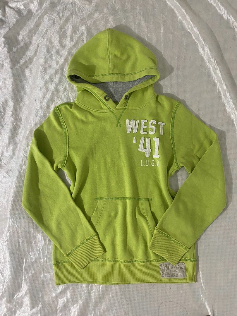 Lime Green Graphic Pullover Hoodie (Category: Coats, Jackets and Outerwear) located in Baguio. Submitted by sollunathrift13 (Listing ID 1466990945, Image 1). Description: S-M Color: Bright lime green / chartreuse with grey contrast hood lining Style: Long-sleeve pullover hoodie with a front kangaroo pocket Graphic Details: White embroidered / applique varsity print on the chest reading “WEST ‘41 L.O.G.G.” Hood & Neckline: Attached hood with grey 